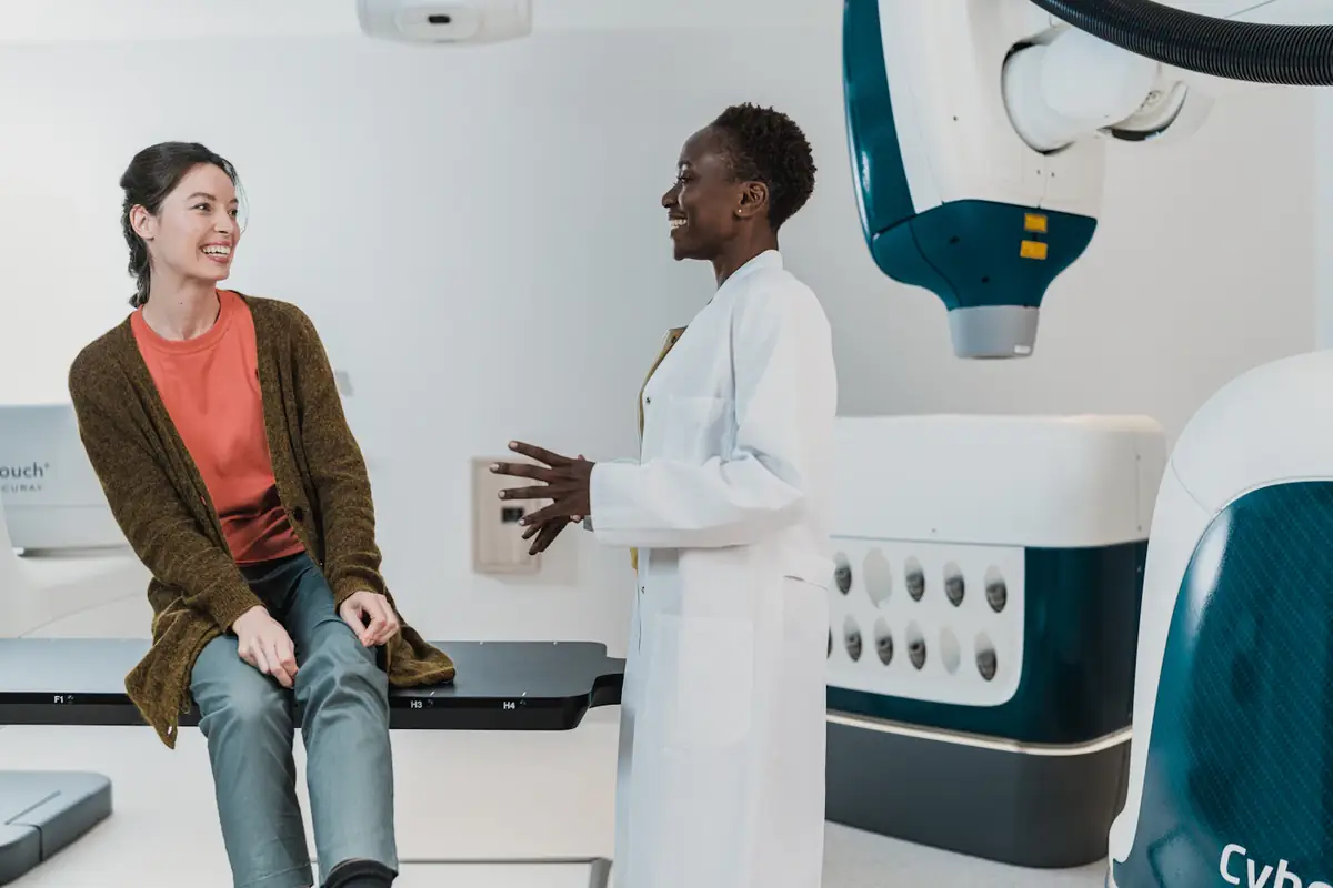 A doctor talking with a patient in a modern consulting room