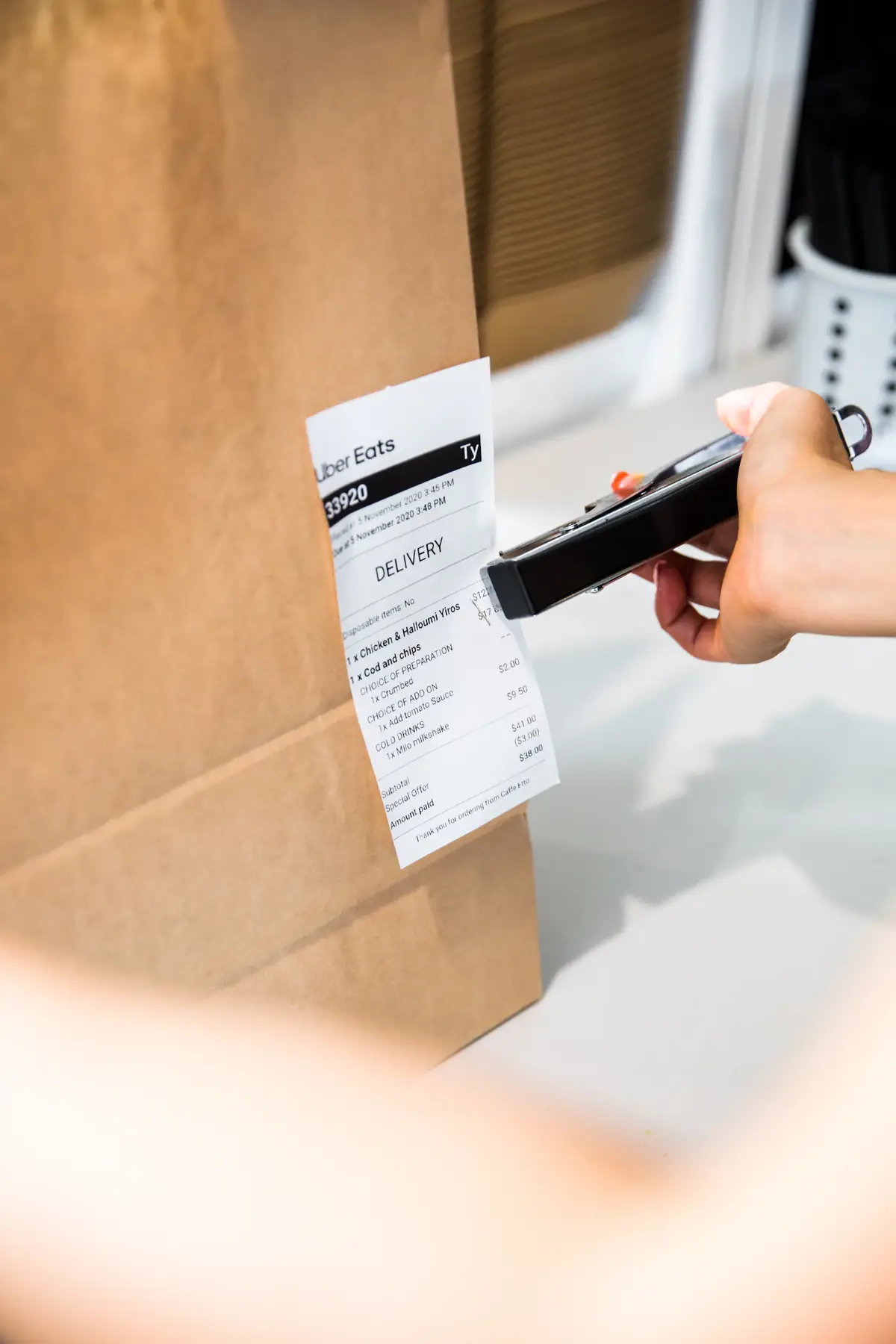 A delivery label being printed on a small printer