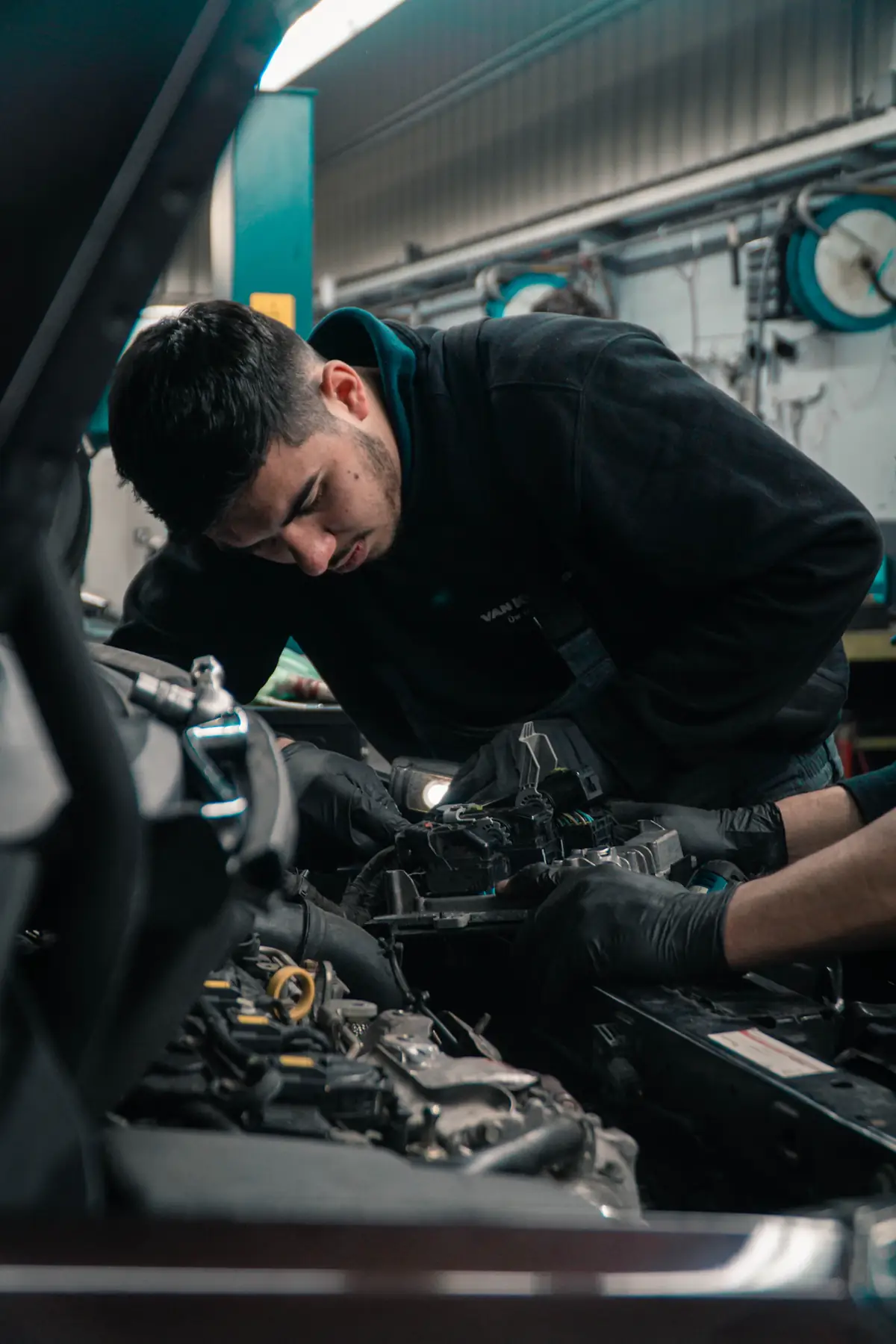 A mechanic working on an engine